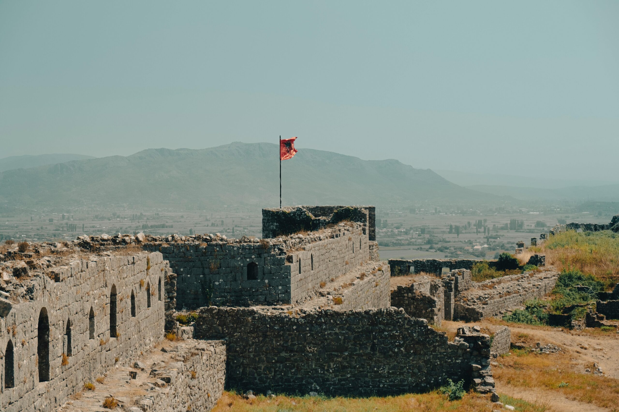 Explore the ancient ruins of Rozafa Castle in Shkodër, Albania with a view of the surrounding landscape.